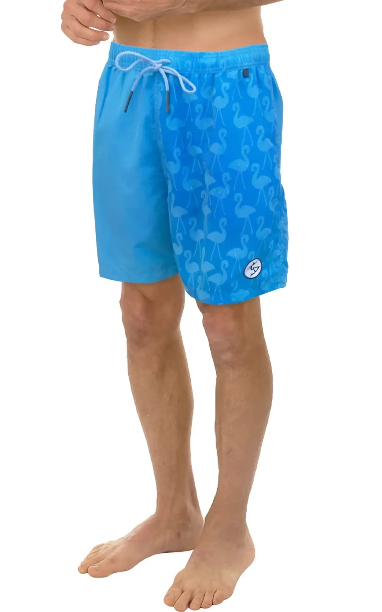 Bright blue water activated swim shorts with a subtle flamingo pattern and white drawstring for beach use