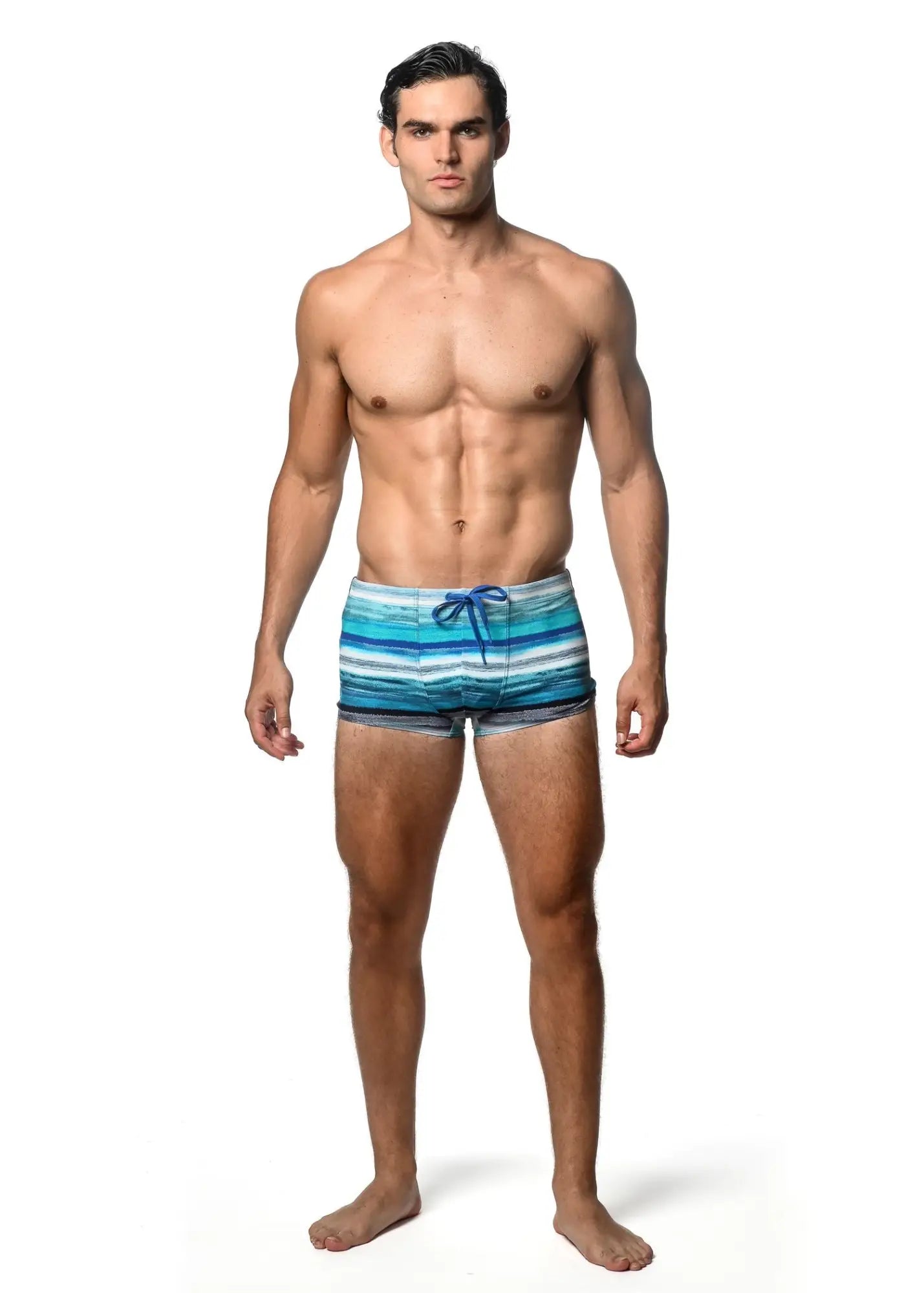 Watercolor stripe printed men’s swim trunks with horizontal blue and white stripes and a matching blue drawstring
