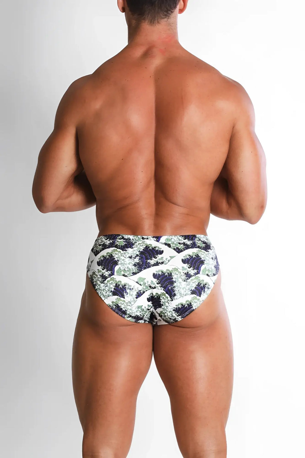 Wet-N-Wild swim briefs featuring blue and white wave pattern designed for beach and pool use