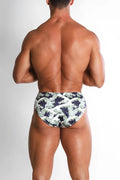 Wet-N-Wild swim briefs featuring blue and white wave pattern designed for beach and pool use