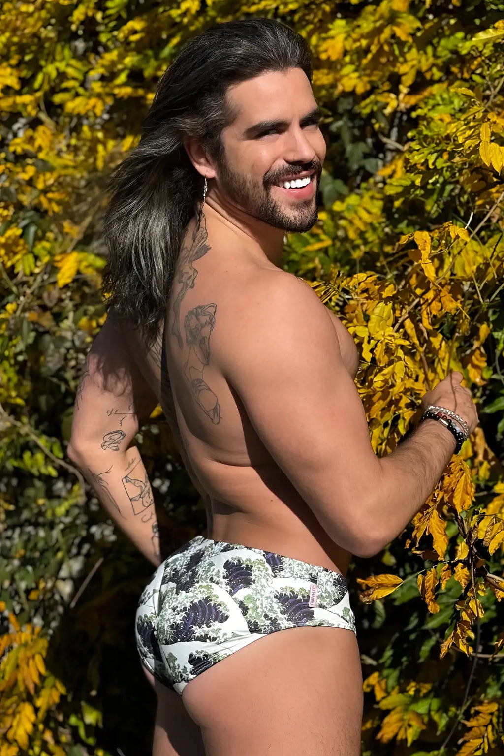 Wet-n-wild swim briefs in white with black and green wave pattern ideal for beach and pool use