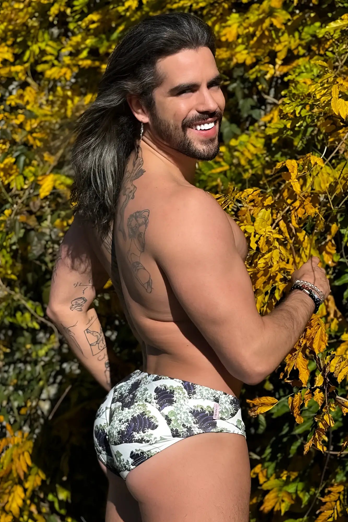 Wet-n-wild swim briefs in white with black and green wave pattern ideal for beach and pool use