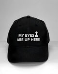 Black baseball cap featuring white text reading "MY EYES ARE UP HERE" with a phallic-shaped arrow graphic.