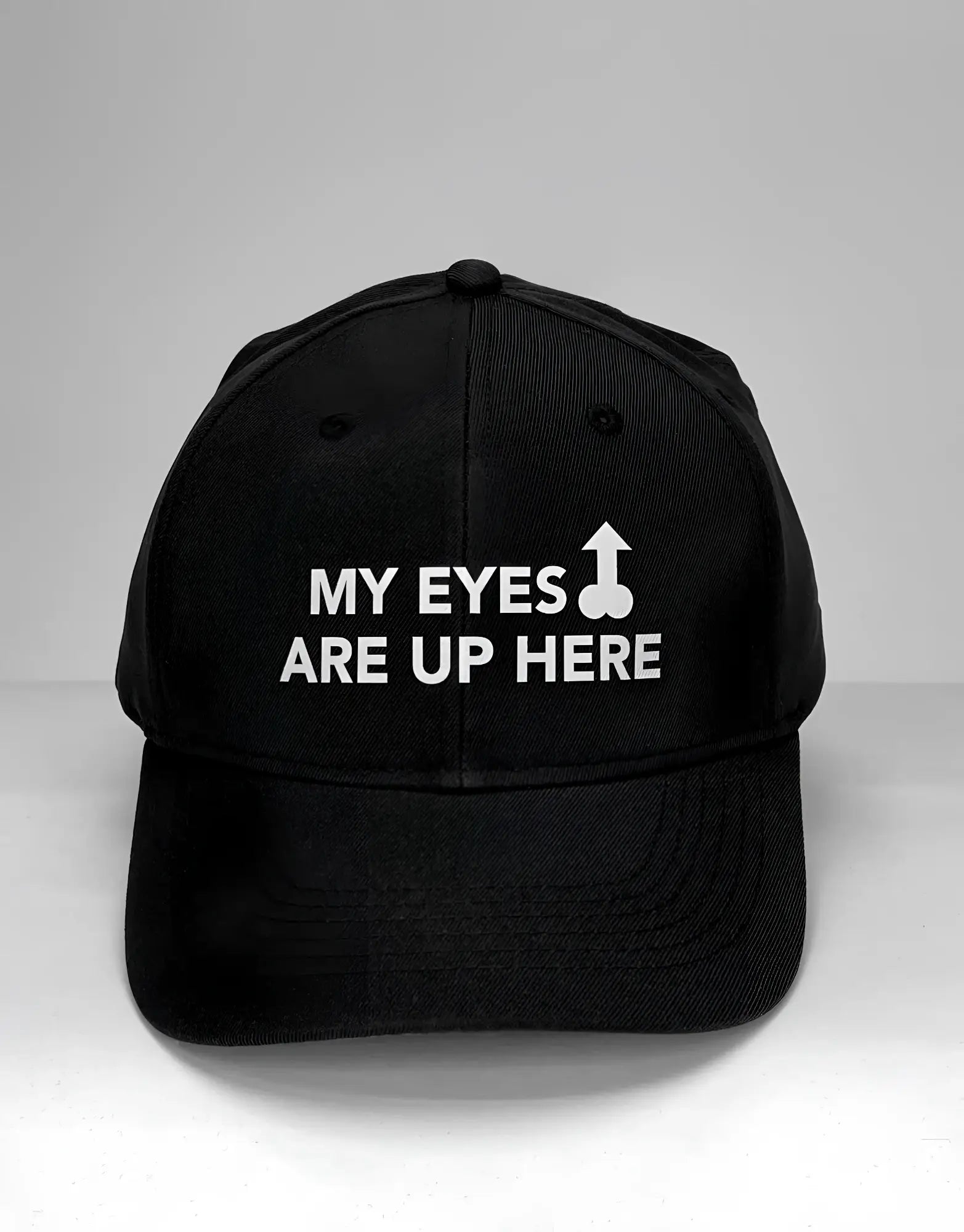 Black baseball cap featuring white text reading "MY EYES ARE UP HERE" with a phallic-shaped arrow graphic.