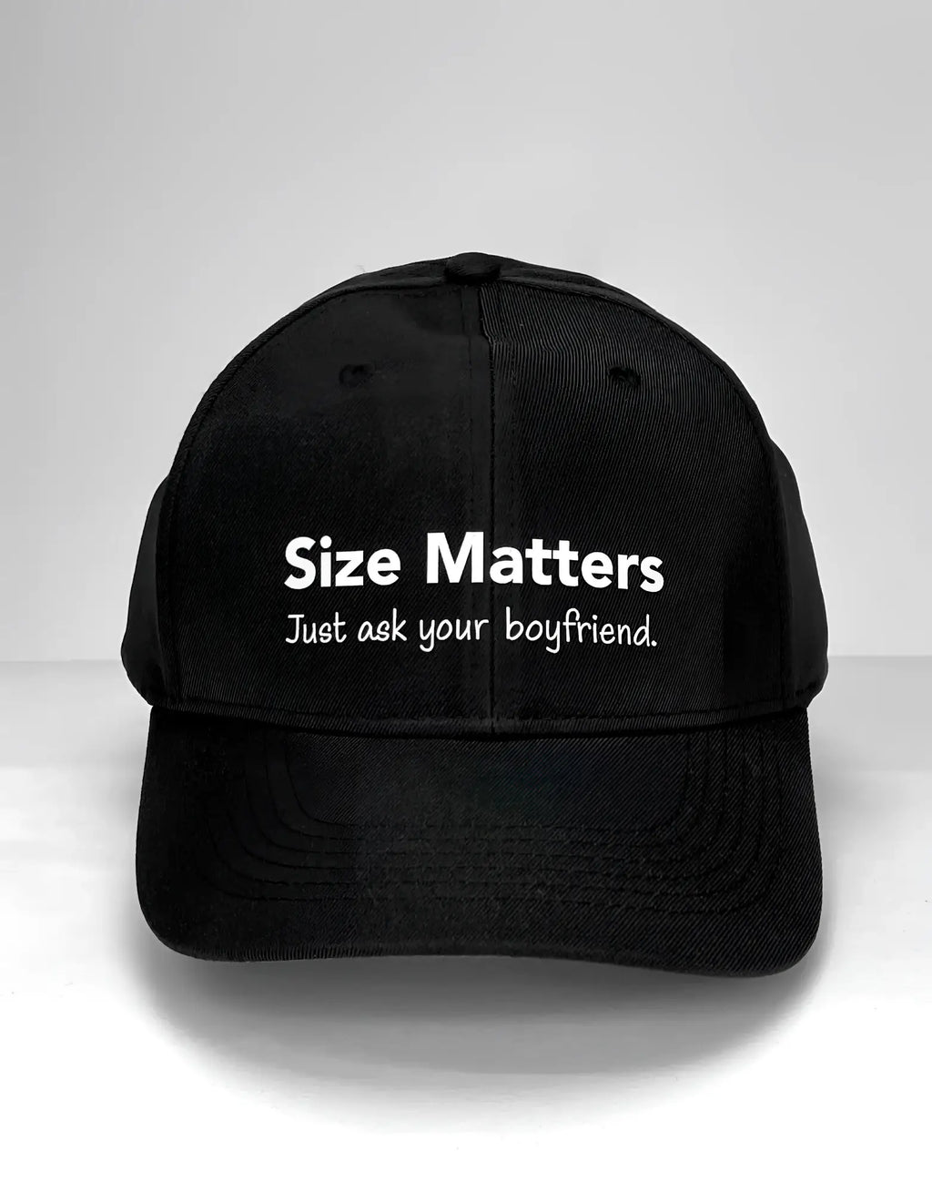 Black baseball cap with "Size Matters. Just ask your boyfriend." printed in white text.