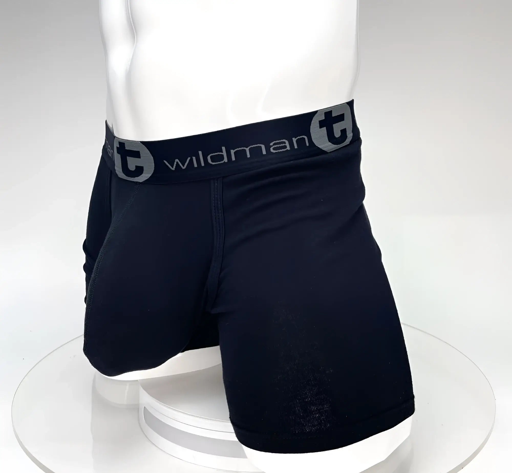 Black 5-inch inseam boxer briefs on a mannequin featuring a pronounced contour pouch and a Wildman T branded waistband.