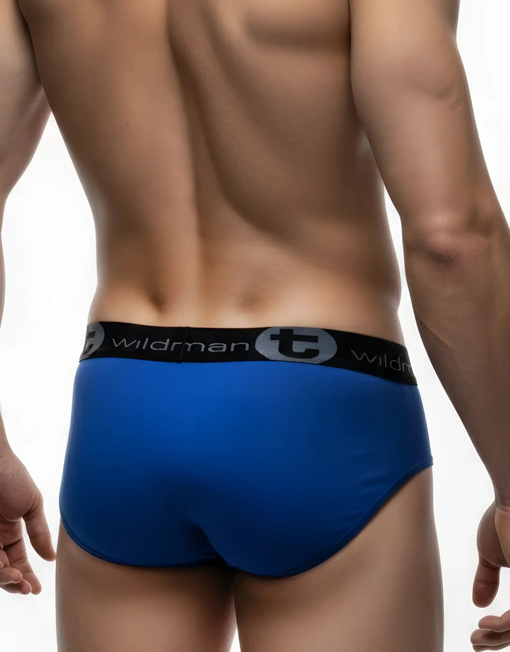 Back view of dark blue Wildman pouch briefs with a black elastic waistband featuring the brand logo.