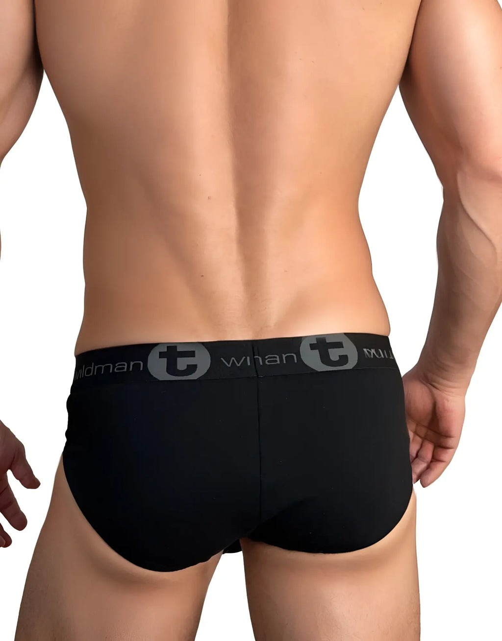 Rear view of black WildmanT cotton brief with logo waistband on a muscular model.