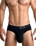 WildmanT black cotton brief with a structured pouch and a branded elastic waistband on a fit male model.