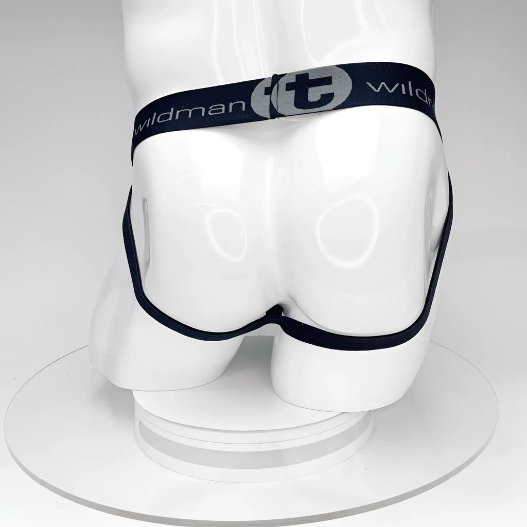 Back view of a black WildmanT jockstrap on a white mannequin torso, featuring a branded elastic waistband with logo.