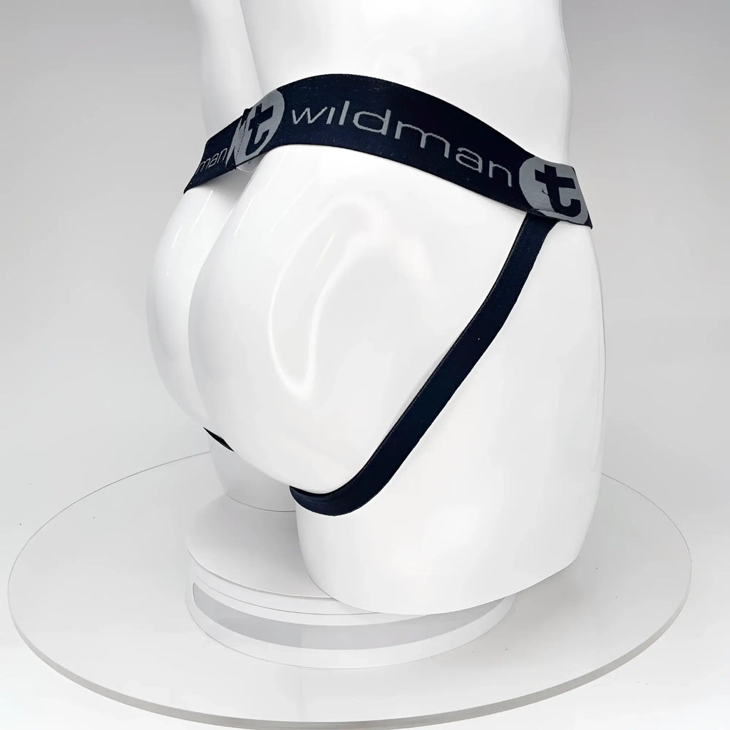 Black WildmanT jockstrap on a white mannequin, featuring a branded elastic waistband and rear strap design.