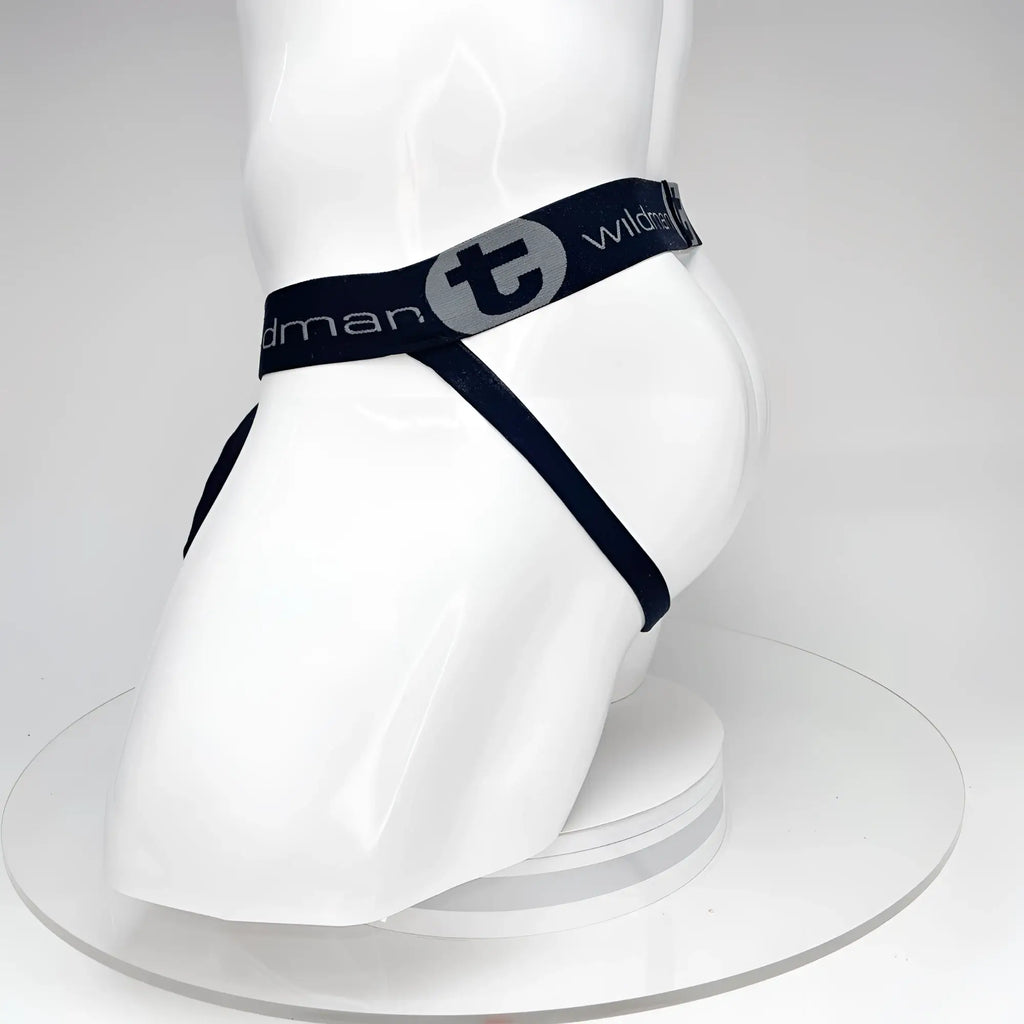 Black WildmanT jockstrap on a white mannequin, featuring a branded elastic waistband with a "t" logo.