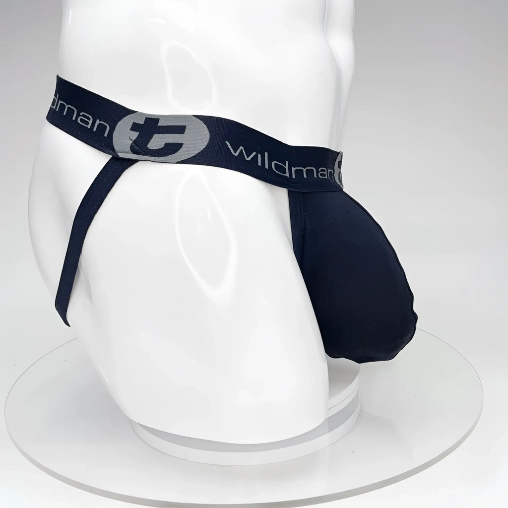 Black WildmanT Big Boy Pouch jockstrap on a white mannequin, featuring a branded elastic waistband with a "T" logo.