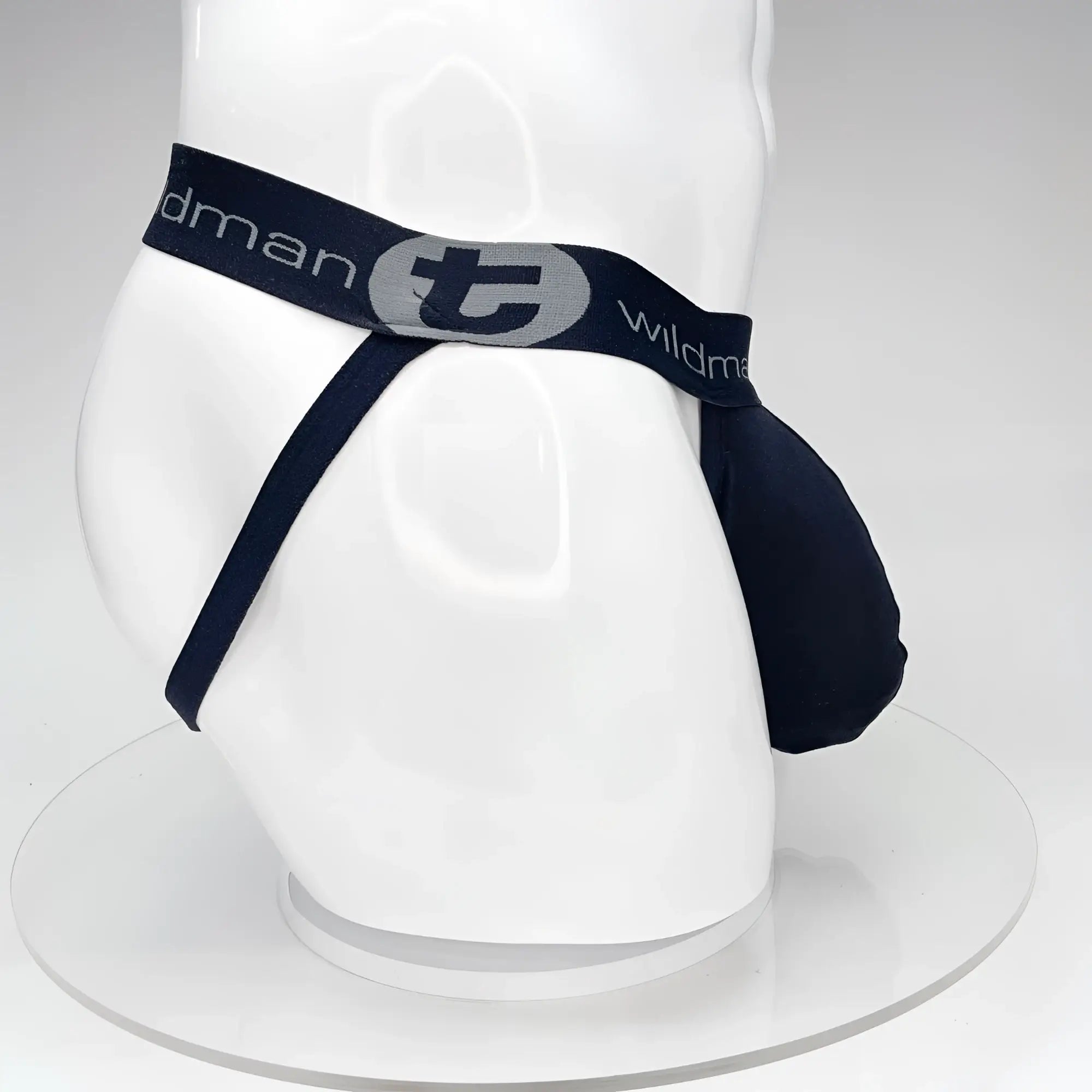 Black WildmanT Big Boy pouch jockstrap on a white mannequin featuring a branded elastic waistband with a "t" logo.