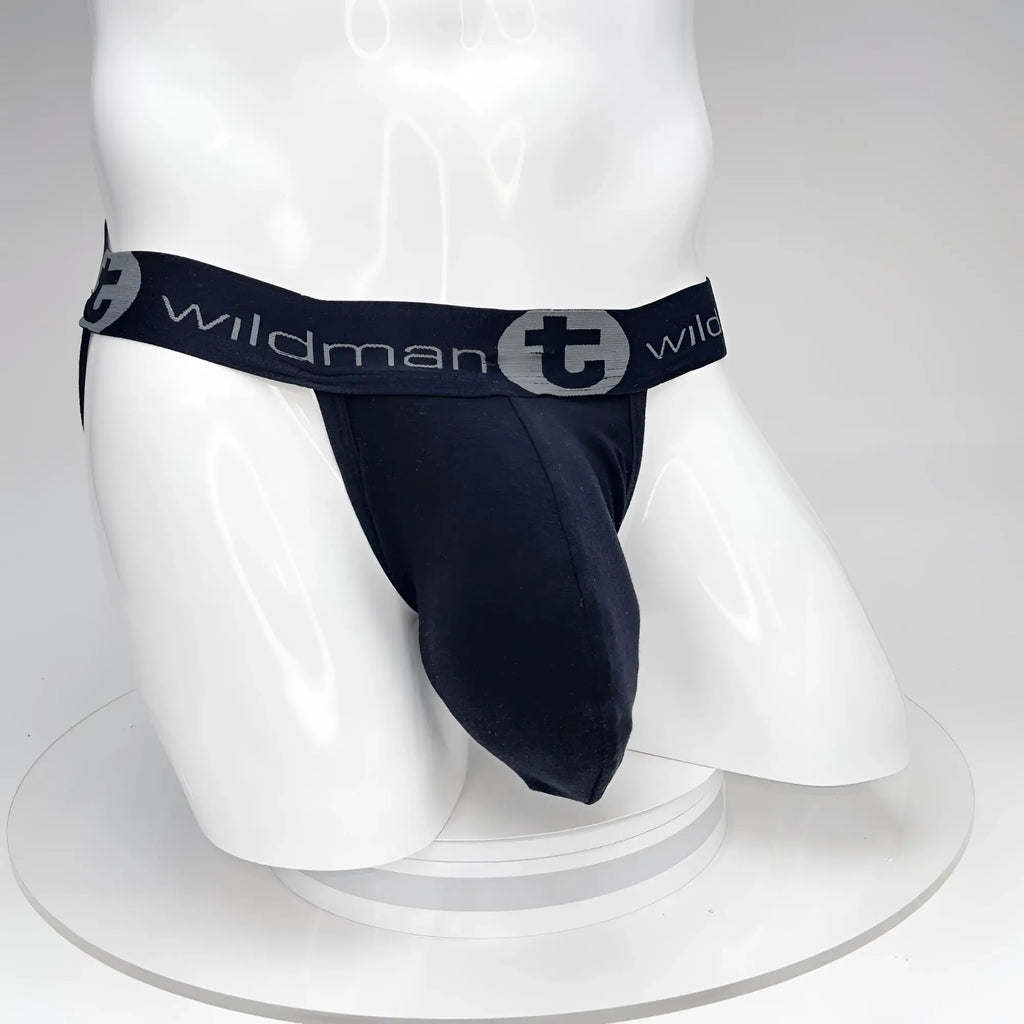 Black WildmanT Big Boy pouch jockstrap on a white mannequin, featuring a branded waistband with grey logo detailing.