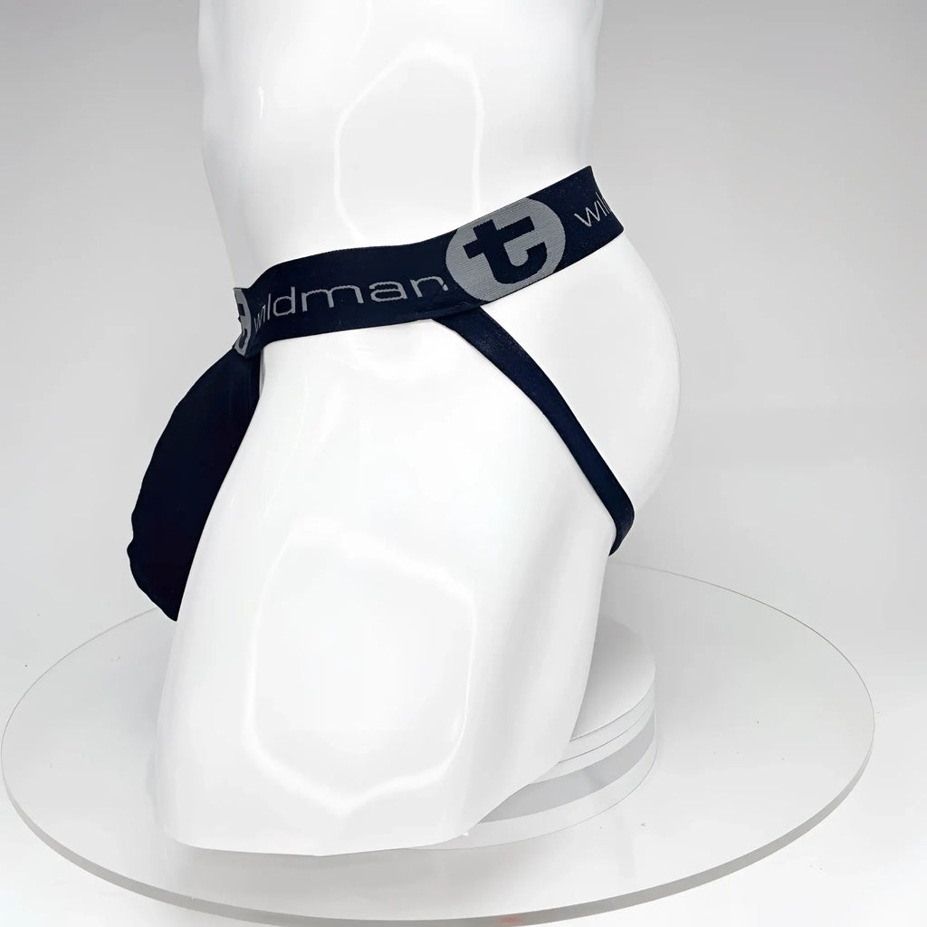 Black WildmanT jockstrap with a pouch and branded elastic waistband on a white mannequin torso.
