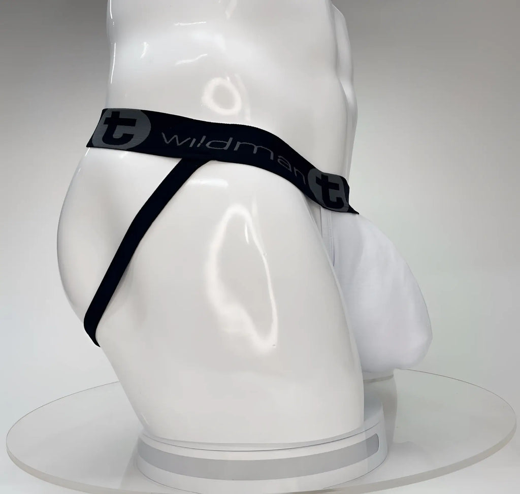 White WildmanT jockstrap with a large front pouch and a black branded waistband on a white mannequin.