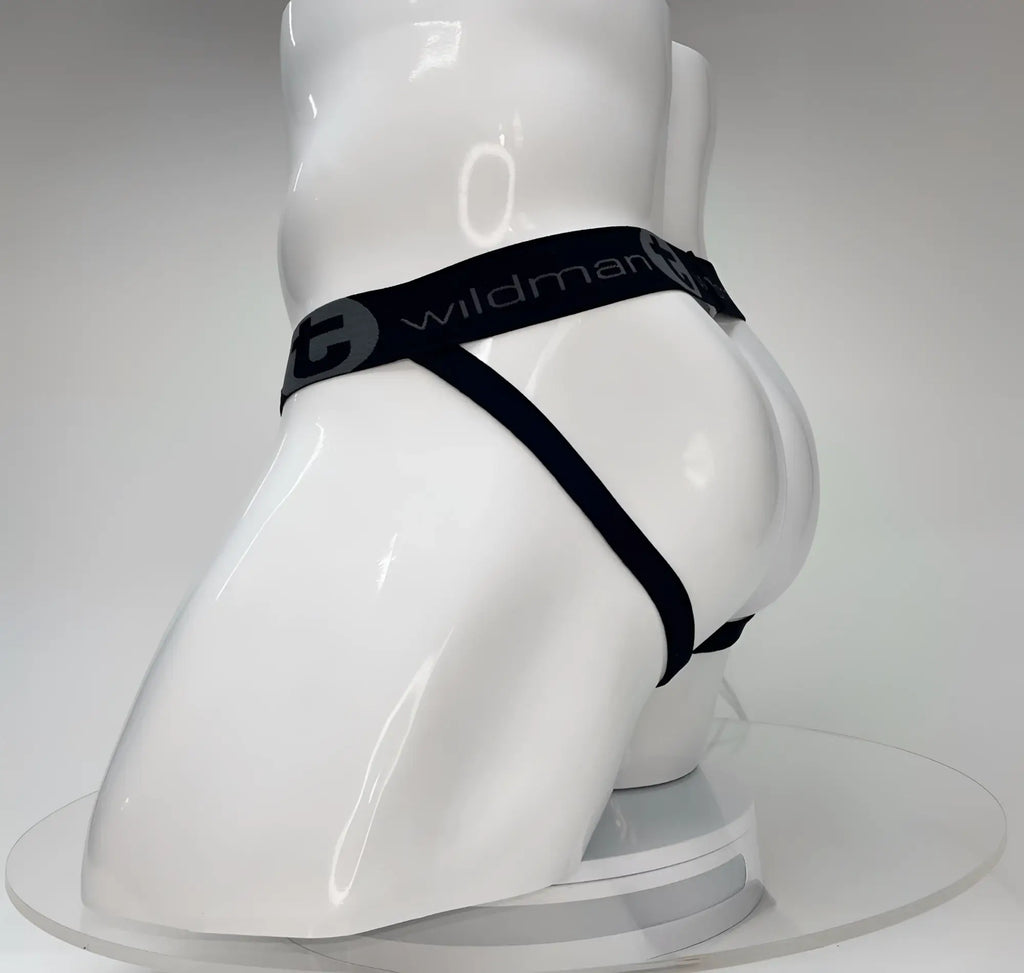 WildmanT Big Boy white jockstrap on a white mannequin featuring a black elastic waistband with brand logo branding.