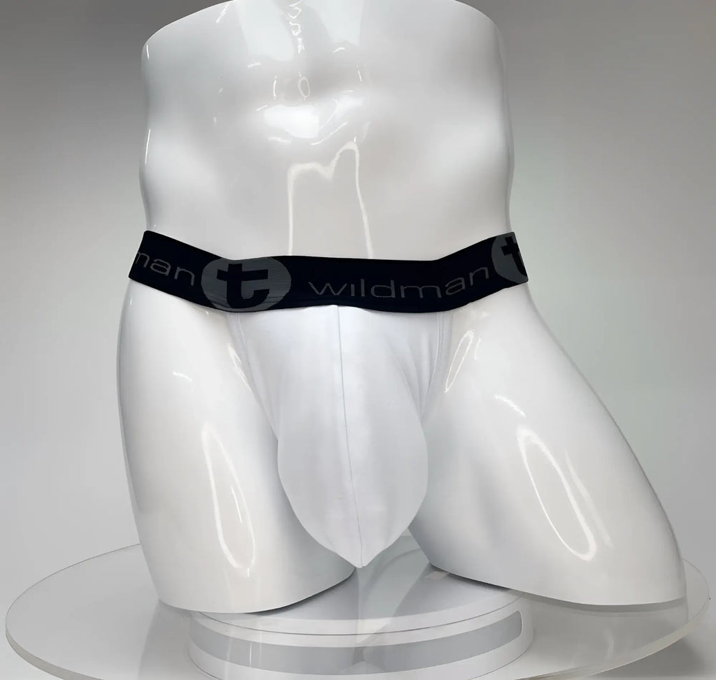 White WildmanT jockstrap with a contoured big-boy pouch and a black branded elastic waistband on a white mannequin.