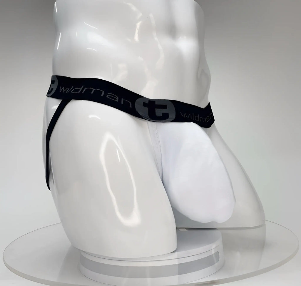 White WildmanT jockstrap with a large front pouch and a black branded waistband on a white mannequin torso.