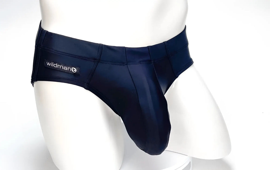 Black WildmanT Big Boy Pouch swim brief on a white mannequin featuring a structured, prominent front pouch.