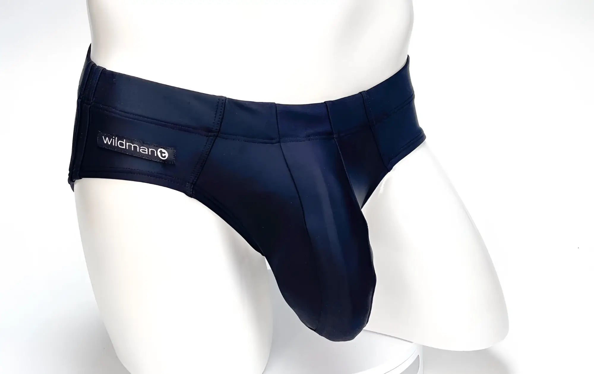 Black WildmanT Big Boy Pouch swim brief on a white mannequin featuring a structured, prominent front pouch.