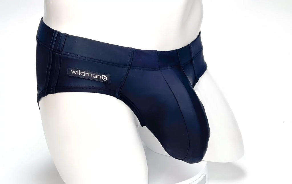 Black WildmanT Big Boy pouch swim brief on a white mannequin torso, featuring a prominent contoured front pouch.