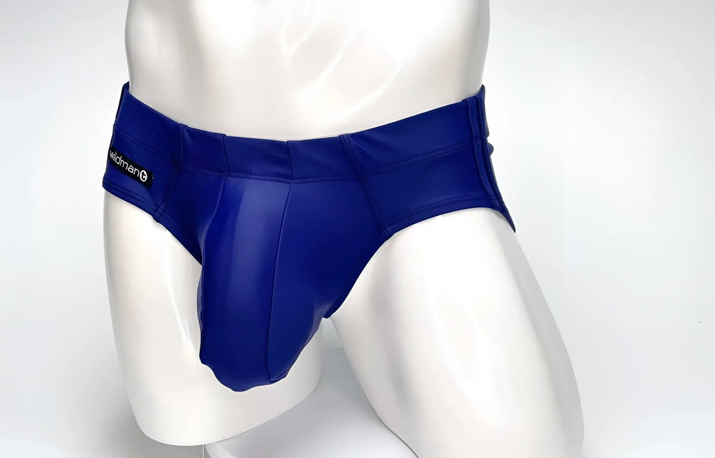 WildmanT navy blue Big Boy Pouch swim brief on a white mannequin, featuring a prominent front pouch and side branding.