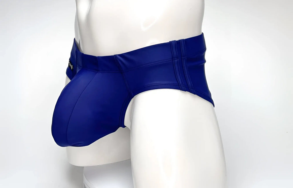WildmanT Big Boy Pouch swim brief in navy blue on a white mannequin, featuring a prominent, contoured front pouch.
