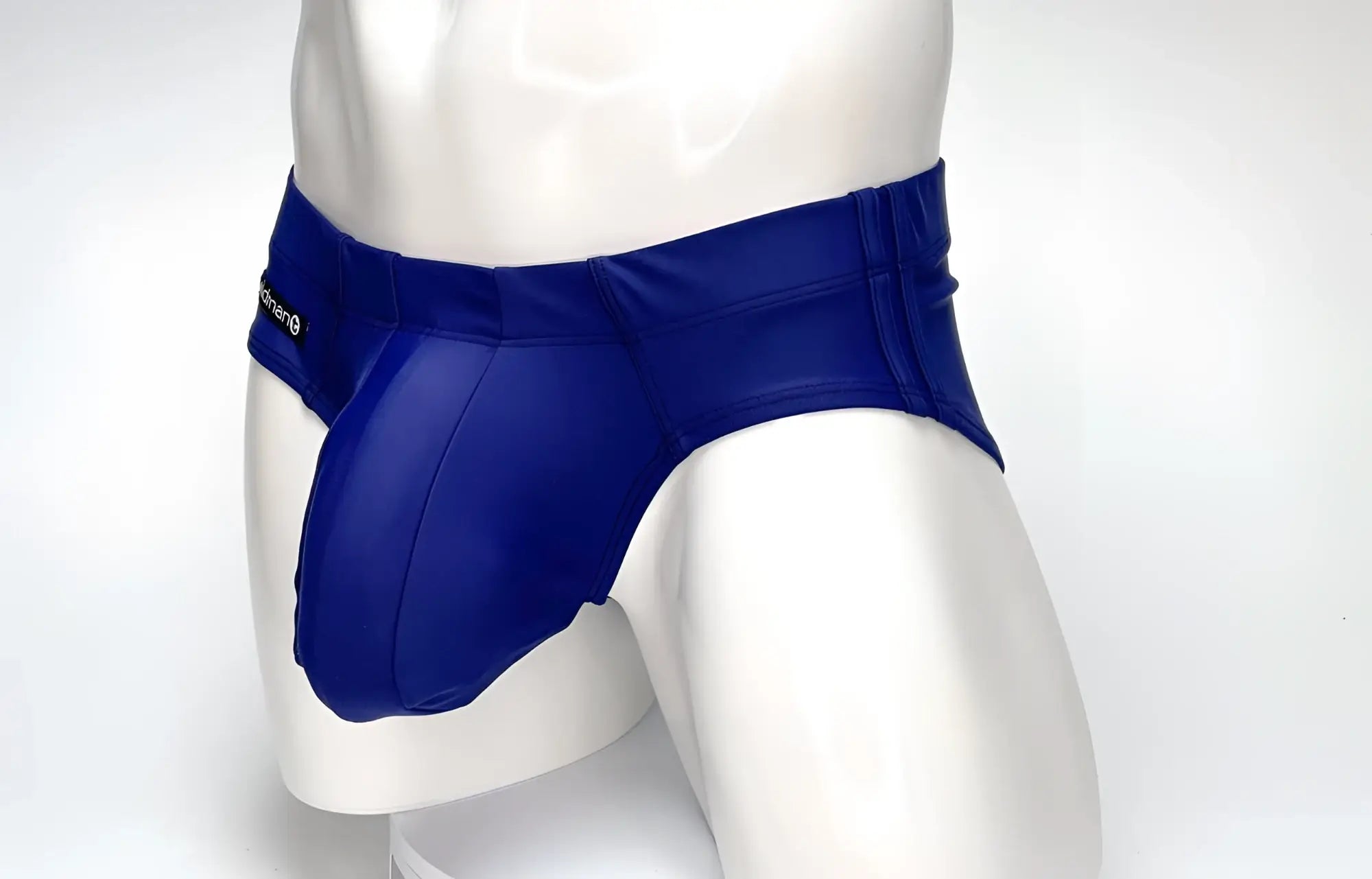 Navy blue WildmanT Big Boy pouch swim brief on a white mannequin torso, featuring a prominent, contoured front pouch.