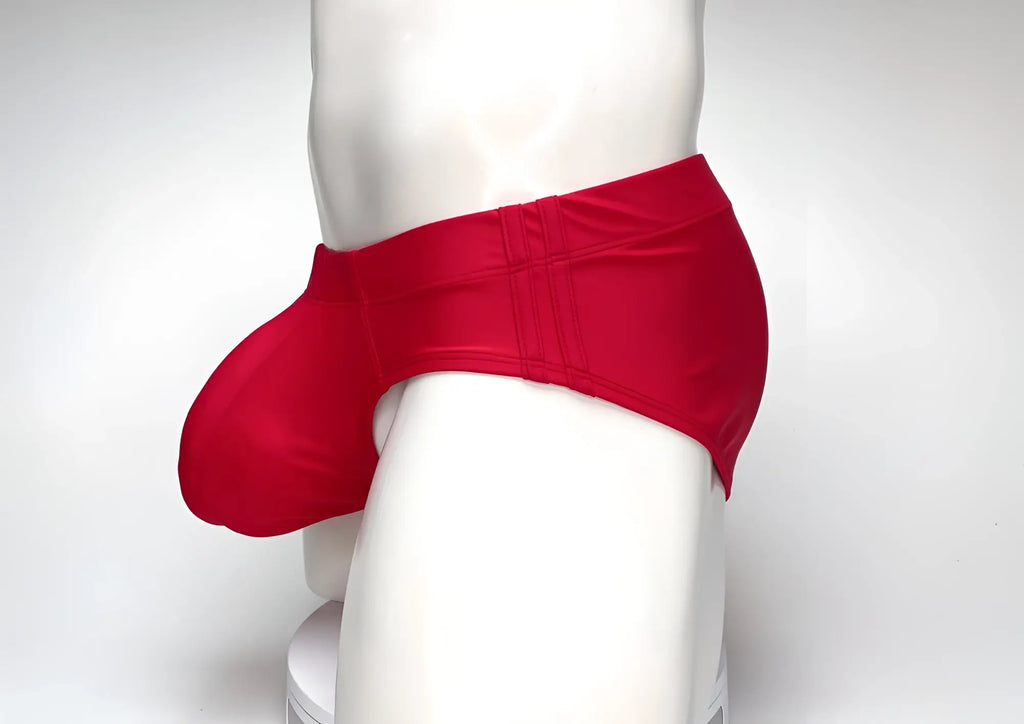 WildmanT Big Boy red swim brief featuring a prominent, rounded front pouch and side-stitched waistband on a mannequin.