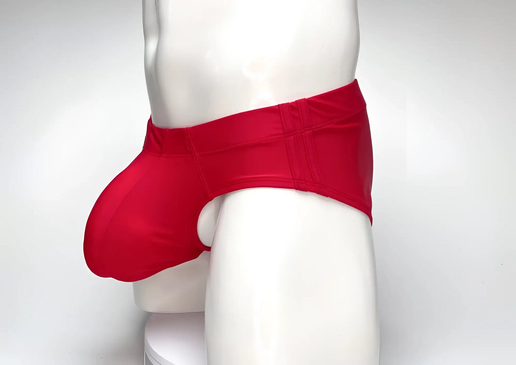 Red WildmanT Big Boy pouch swim brief worn by a mannequin, featuring a contoured front pouch and wide side panels.