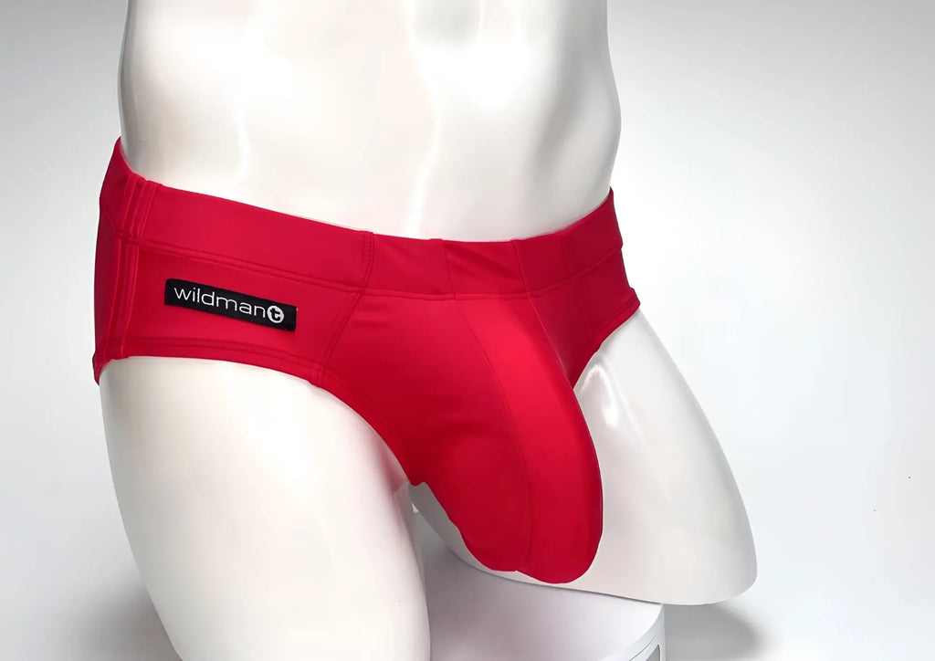 Red WildmanT swim brief with a large contoured front pouch on a white mannequin.