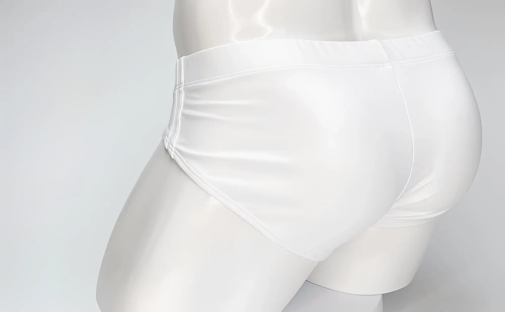 Back view of a plain white WildmanT Big Boy pouch swim brief on a white mannequin torso.