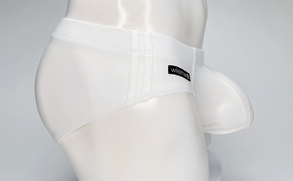 White WildmanT Big Boy Pouch swim brief on a mannequin, featuring a prominent front pouch and side stitching details.