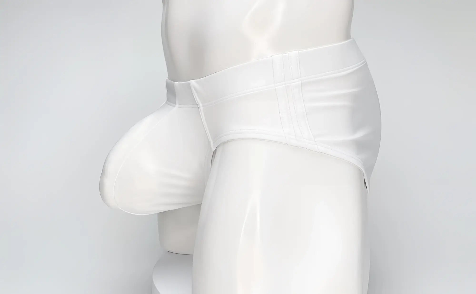 White WildmanT Big Boy pouch swim brief worn by a white mannequin, featuring a distinct, prominent front pouch design.