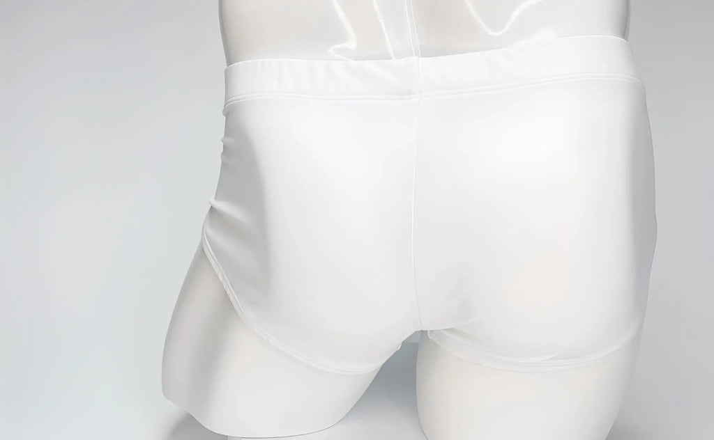 Back view of WildmanT white swim briefs on a mannequin, featuring a clean, minimalist design with full-coverage fit.