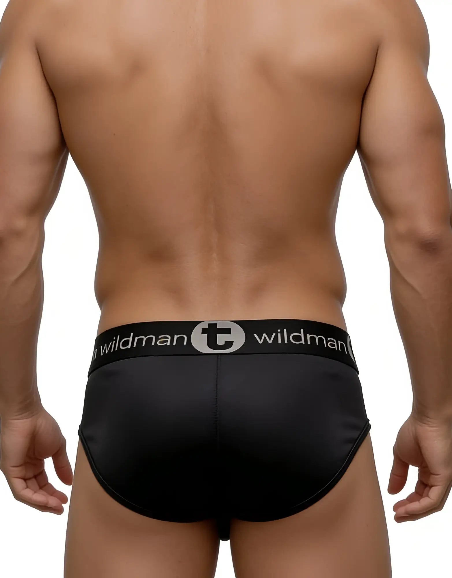 Back view of a muscular man wearing black Big Boy Pouch briefs with a branded "Wildman" elastic waistband.