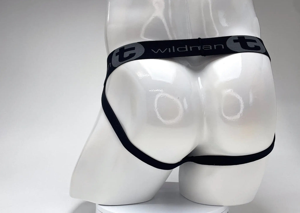 WildmanT black jockstrap with a branded elastic waistband on a white mannequin.