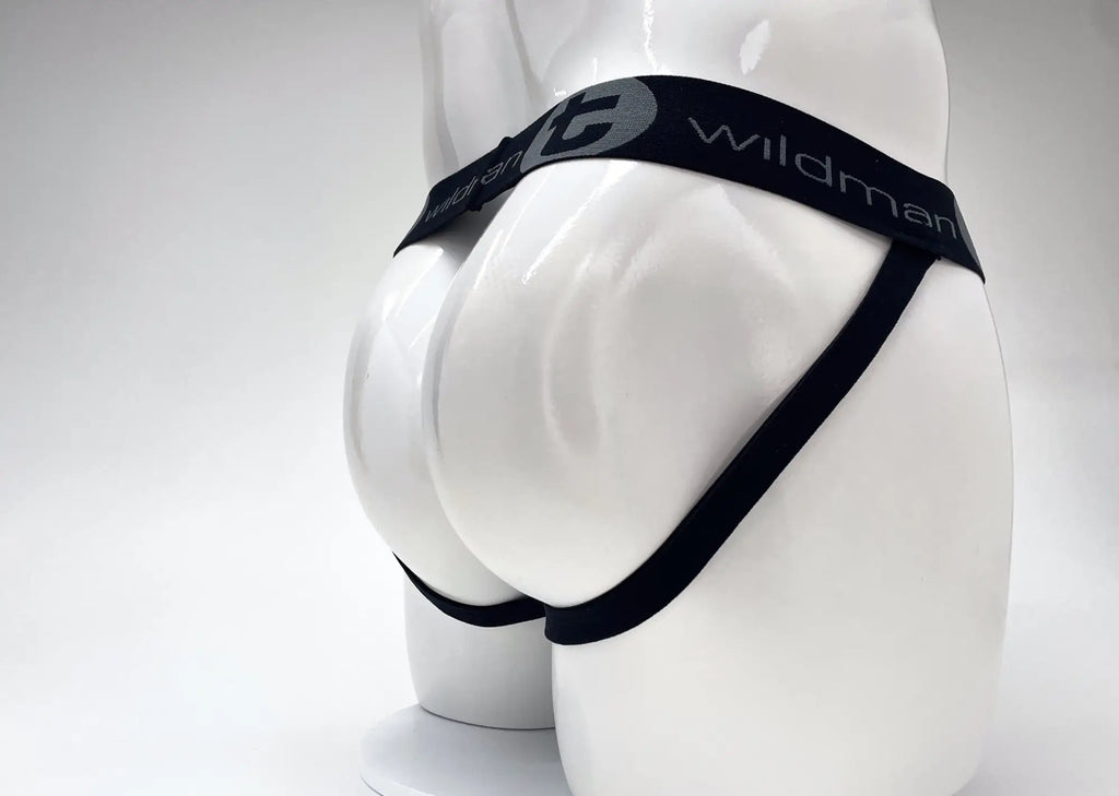 WildmanT black jockstrap with branded waistband on a white mannequin torso, rear view.
