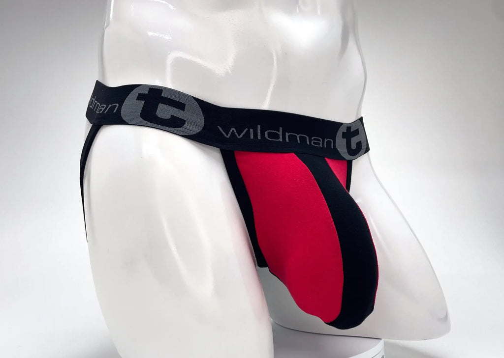 Red and black jockstrap with a large pouch and elastic waistband featuring the grey "WildmanT" logo on a mannequin.