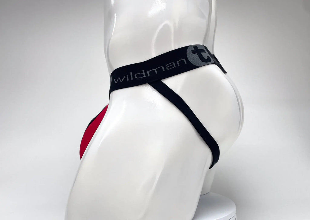 Red and black jockstrap on a mannequin, featuring a WildmanT branded black elastic waistband and a red front pouch.