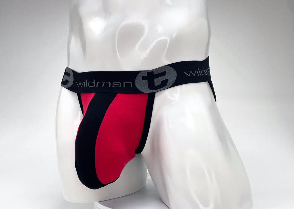 Red and black striped cotton jockstrap with a large pouch and black branded waistband on a white mannequin torso.