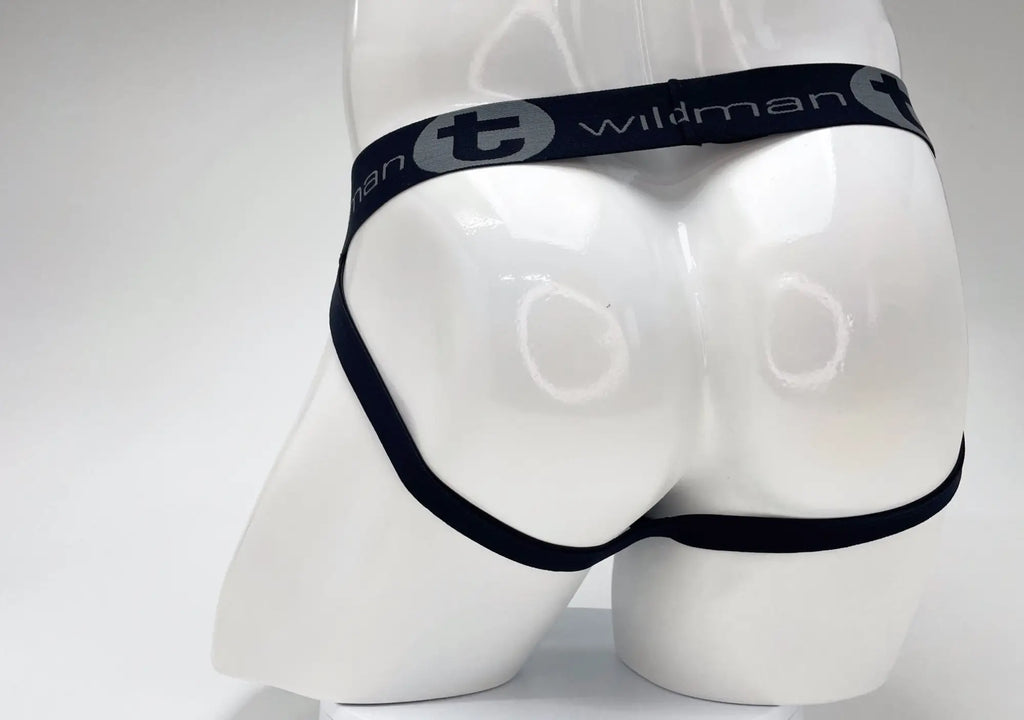Back view of a WildmanT jockstrap on a mannequin, featuring a black waistband with gray logo text.