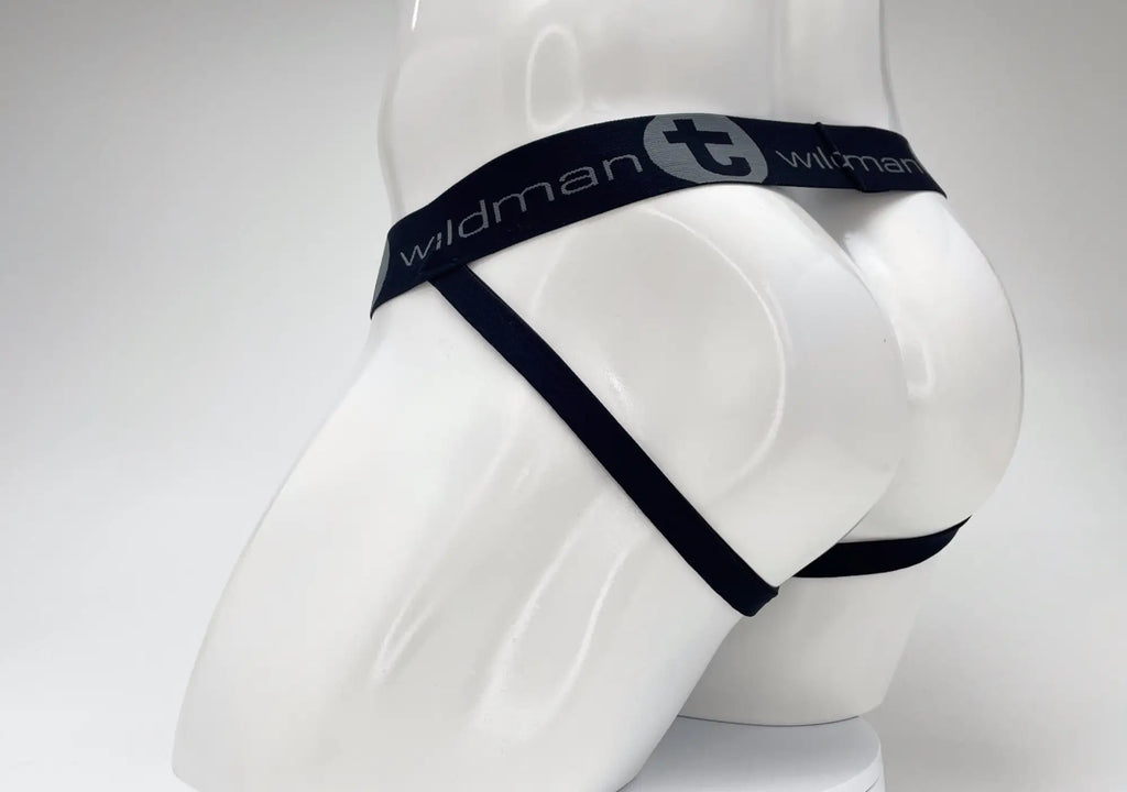 Dark navy jockstrap on a white mannequin, featuring a branded waistband with "WildmanT" logo.
