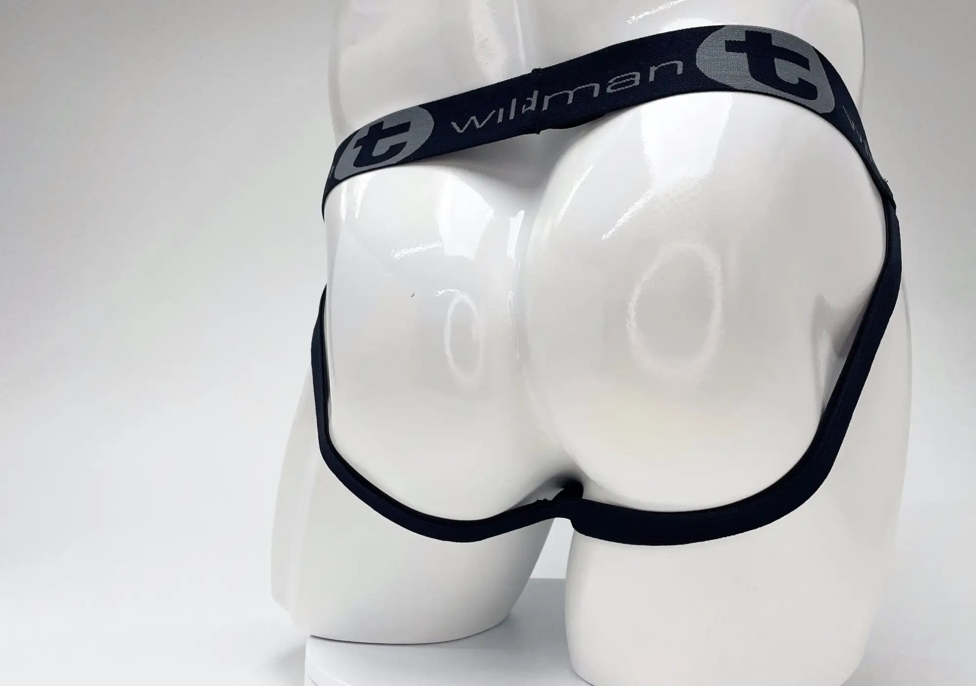 WildmanT jockstrap on a mannequin, featuring a black waistband with "wildman" logo and grey 'T' branding.