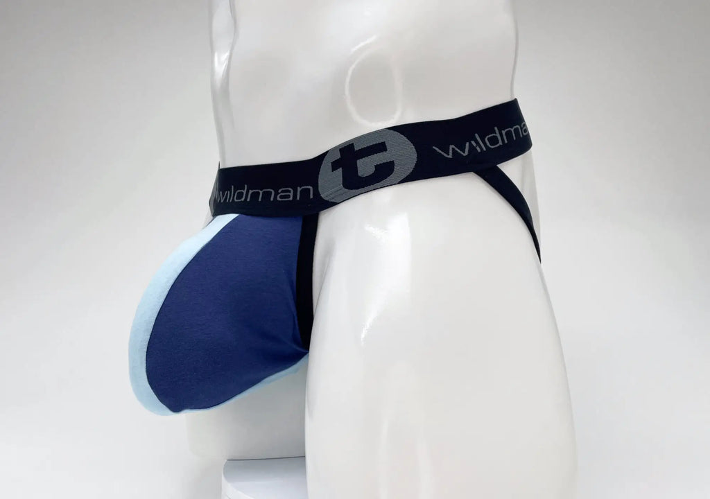 WildmanT royal and baby blue cotton jockstrap with a large pouch and black branded elastic waistband on a mannequin.