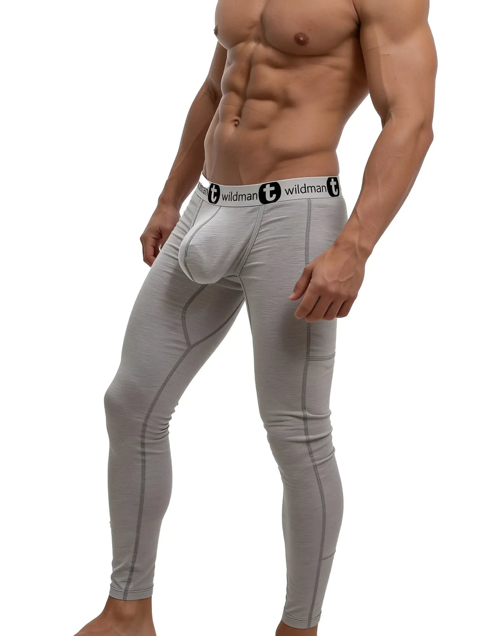 Athletic man wearing heather gray WildmanT long johns with a prominent "Big Boy" pouch and branded elastic waistband.