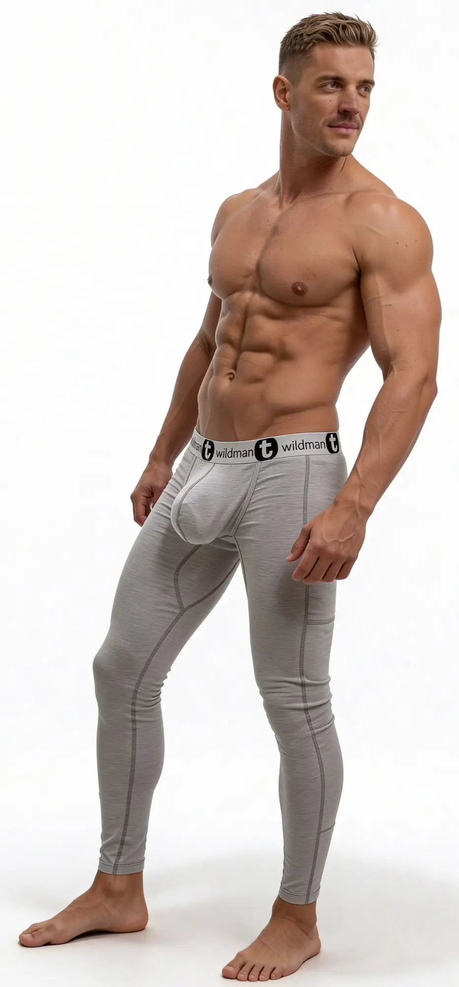Grey WildmanT long johns with a prominent Big Boy pouch and branded elastic waistband worn by a muscular man.
