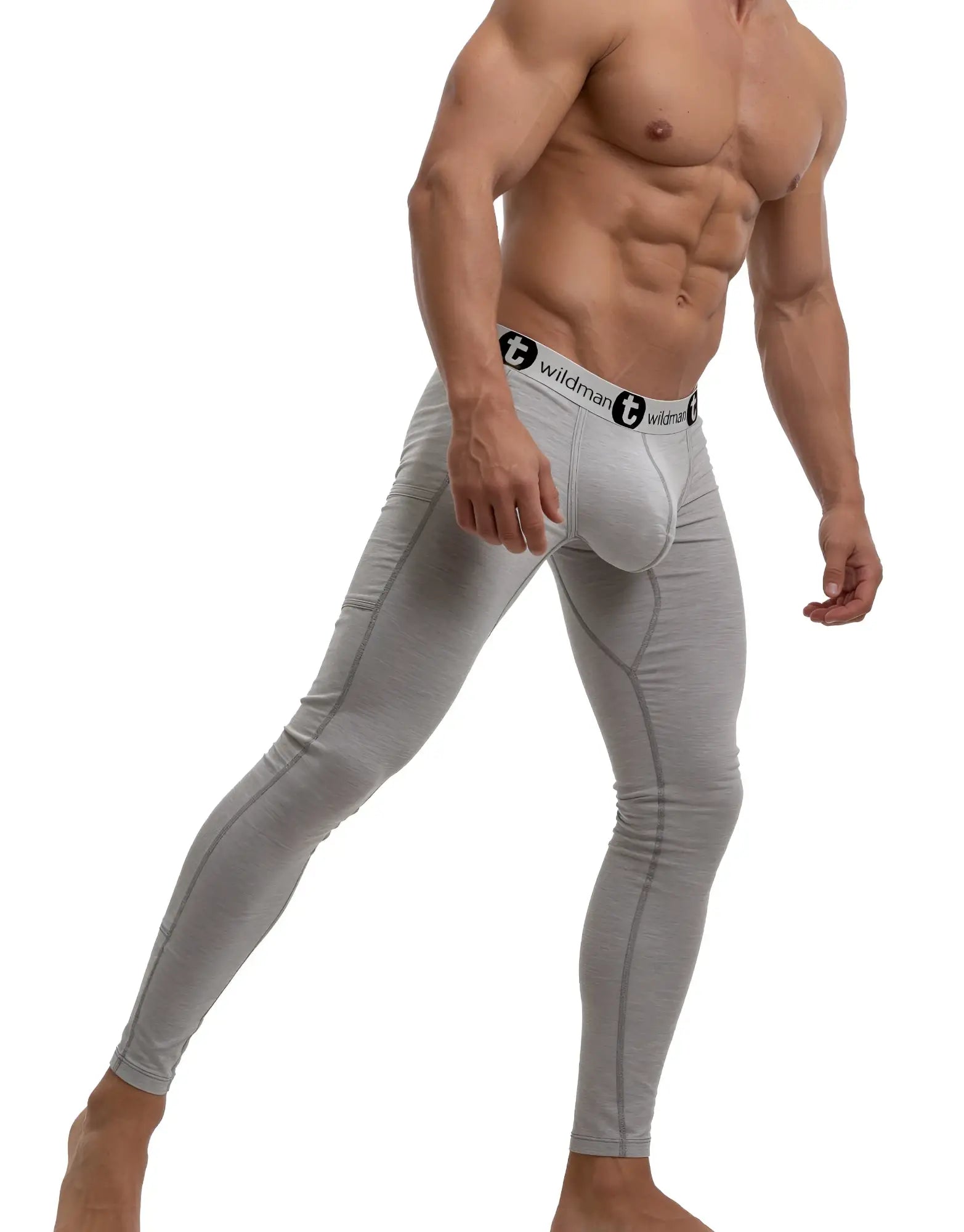 Grey WildmanT long johns featuring a contour "big boy" pouch and a branded elastic waistband on a muscular model.